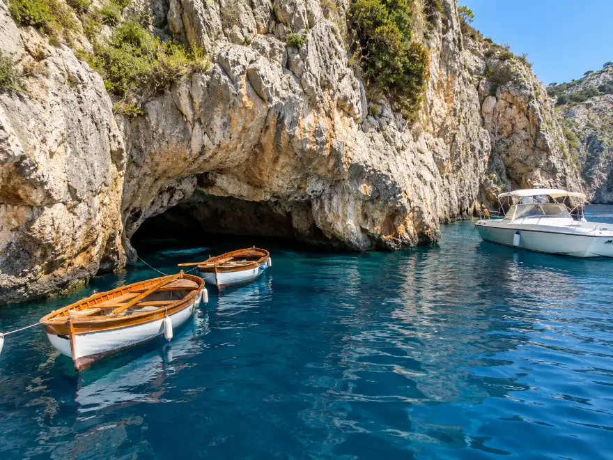 The entrance to the Blue Grotto with its rowing boats